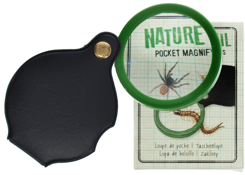 Pocket Magnifying glass in a protective cover  looking through it to increase the size of text on packaging